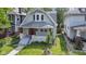 Exterior view of a charming home with a well-manicured lawn and a real estate sign at 909 N Parker Ave, Indianapolis, IN 46201
