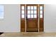 Modern front door with glass, natural light, and a clean aesthetic at 909 N Parker Ave, Indianapolis, IN 46201