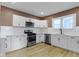 Updated kitchen featuring modern appliances and subway tile backsplash at 909 N Parker Ave, Indianapolis, IN 46201