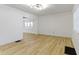 Bright, spacious living room with modern flooring and fresh, white walls at 909 N Parker Ave, Indianapolis, IN 46201