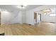 Open-concept living room features new floors and a staircase at 909 N Parker Ave, Indianapolis, IN 46201