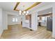 Open floor plan showcasing living room with wood floors leading to a kitchen at 909 N Parker Ave, Indianapolis, IN 46201