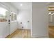 The mud room has plenty of natural light, new floors, and new paint at 909 N Parker Ave, Indianapolis, IN 46201