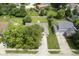 An aerial view of a charming suburban home with a well-maintained lawn and mature trees at 11418 Geist Valley Dr, Indianapolis, IN 46236