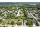 Aerial view of a neighborhood showcasing well-maintained homes and lush greenery at 11418 Geist Valley Dr, Indianapolis, IN 46236