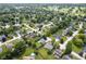 Overhead view of a neighborhood featuring homes with lawns and mature tree coverage at 11418 Geist Valley Dr, Indianapolis, IN 46236
