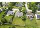 Aerial view of home with spacious green backyard, bordered with mature trees at 11418 Geist Valley Dr, Indianapolis, IN 46236