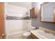 Full bathroom showcasing updated vanity and combined tub and shower with subway tile at 11418 Geist Valley Dr, Indianapolis, IN 46236