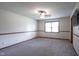 Spacious bedroom featuring plush carpeting, a ceiling fan, and natural light at 11418 Geist Valley Dr, Indianapolis, IN 46236