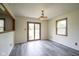 Bright dining room featuring a sliding glass door to the backyard and wood-look floors at 11418 Geist Valley Dr, Indianapolis, IN 46236