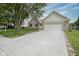 Charming single-Gathering home featuring a two-car garage, brick accents, and well-maintained landscaping at 11418 Geist Valley Dr, Indianapolis, IN 46236