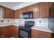 Well-maintained kitchen boasting classic cabinets, modern appliances, and countertops at 11418 Geist Valley Dr, Indianapolis, IN 46236