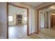 Open living room featuring a brick fireplace, hardwood floors, and lots of natural light at 11418 Geist Valley Dr, Indianapolis, IN 46236