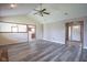Open living room with hardwood floors leading to the kitchen and entry, perfect for entertaining at 11418 Geist Valley Dr, Indianapolis, IN 46236