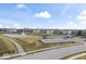 An aerial view of the community, featuring a pond with a fountain and a playground at 11429 Lottie Cir, Noblesville, IN 46060