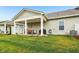 Lush backyard with a covered patio, ideal for relaxation and outdoor activities at 11429 Lottie Cir, Noblesville, IN 46060