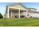 A view of the home's backyard and covered patio, perfect for outdoor entertaining at 11429 Lottie Cir, Noblesville, IN 46060