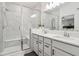Bright bathroom featuring a glass-enclosed shower, double sinks, and quartz countertops at 11429 Lottie Cir, Noblesville, IN 46060