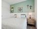 Relaxing bedroom showcasing a comfortable bed and decorative wall art at 11429 Lottie Cir, Noblesville, IN 46060