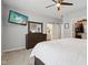 Comfortable bedroom with ensuite bathroom, walk-in closet, ceiling fan and tv at 11429 Lottie Cir, Noblesville, IN 46060