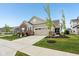 Charming single-Gathering home featuring a two-car garage and a well-manicured front yard at 11429 Lottie Cir, Noblesville, IN 46060
