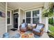 Charming front porch with stylish seating and decor at 11429 Lottie Cir, Noblesville, IN 46060