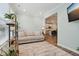 Open living space showcasing a comfortable couch and a view into the well-lit kitchen at 11429 Lottie Cir, Noblesville, IN 46060