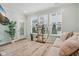 Bright living room with a modern plant stand, lots of natural light, and stylish decor at 11429 Lottie Cir, Noblesville, IN 46060