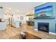 Bright open-concept living room flows seamlessly into the kitchen and dining area with hardwood floors at 11429 Lottie Cir, Noblesville, IN 46060