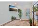 Cozy living area with a mounted TV and a glass door leading to outdoor space at 11429 Lottie Cir, Noblesville, IN 46060