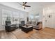 Inviting living room with hardwood floors, abundant windows, and comfortable seating at 11429 Lottie Cir, Noblesville, IN 46060