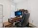 Comfortable office featuring a modern desk, black leather chair and natural lighting at 11429 Lottie Cir, Noblesville, IN 46060