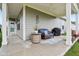 Covered patio with comfortable seating and a grill, perfect for outdoor entertaining at 11429 Lottie Cir, Noblesville, IN 46060