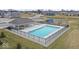 Aerial view of the community pool and playground, perfect for summer fun and relaxation at 11429 Lottie Cir, Noblesville, IN 46060
