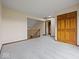 A carpeted bedroom has a closet, stairs, and railing at 1205 Cypress Dr, Shelbyville, IN 46176