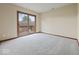 A carpeted bedroom has a sliding door to a balcony at 1205 Cypress Dr, Shelbyville, IN 46176