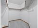 Empty walk-in closet with carpeting and shelving, ready to be organized at 1205 Cypress Dr, Shelbyville, IN 46176