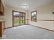 Well-lit dining area with sliding glass door to backyard at 1205 Cypress Dr, Shelbyville, IN 46176