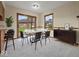 A well-staged dining room with sliding glass doors to the back yard at 1205 Cypress Dr, Shelbyville, IN 46176
