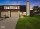 Inviting townhome with attached two-car garage and well-manicured lawn at 1205 Cypress Dr, Shelbyville, IN 46176