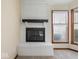 Modern white brick fireplace in a well-lit living room at 1205 Cypress Dr, Shelbyville, IN 46176