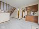 Spacious living room featuring a staircase and dining area at 1205 Cypress Dr, Shelbyville, IN 46176