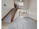 Open living room showcasing staircase and second story overlook at 1205 Cypress Dr, Shelbyville, IN 46176