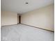 Large, empty living room with neutral walls and new carpet at 1205 Cypress Dr, Shelbyville, IN 46176