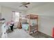 Bedroom with ceiling fan, bunk bed, and window letting in natural light at 1255 Crabapple Rd, Franklin, IN 46131