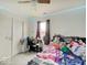 Cozy bedroom with ceiling fan, carpet, and a window letting in natural light at 1255 Crabapple Rd, Franklin, IN 46131