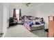This cozy bedroom features wall decor, a fan, and a large window at 1255 Crabapple Rd, Franklin, IN 46131