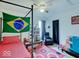 Bedroom featuring ceiling fan, window, pink rug, and chair at 1255 Crabapple Rd, Franklin, IN 46131