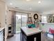 Bright, open kitchen features a breakfast bar and sliding door access to the backyard at 1255 Crabapple Rd, Franklin, IN 46131