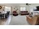 Open-concept living room with generous seating, neutral carpet, and lots of natural light at 1255 Crabapple Rd, Franklin, IN 46131